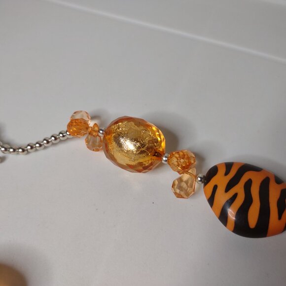 21 Inch Orange Plastic Bead Necklace With Tiger Stripes - Picture 7 of 12
